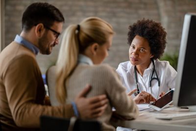 Couple with physician Getty Images 1183617757