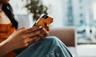 Woman using smartphone Getty Images 1194600794