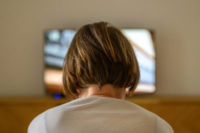 Woman in front of TV Getty Images 2207757712