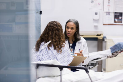 Doctor talking with teen patient Getty Images 1207750770