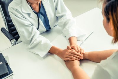 Doctor supporting patient Getty Images 1134712414