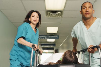 Nurses with patient on gurney Getty Images 1035095394