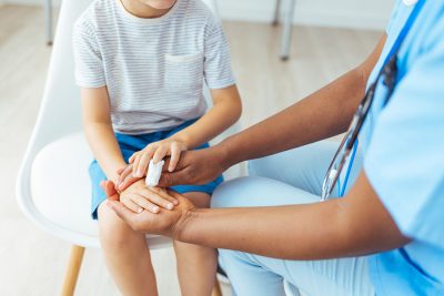 Injured child with nurse Getty Images 1415364178