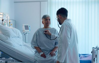 Older female heart patient with physician Getty Images 2162083873