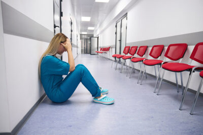 Exhausted healthcare worker Getty Images 1414762308
