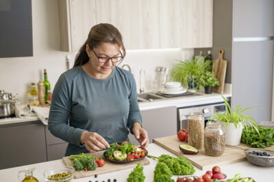 Woman preparing vegetarian meal Getty Images 1487545862