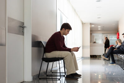 Male teen in waiting room Getty Images 2162410663