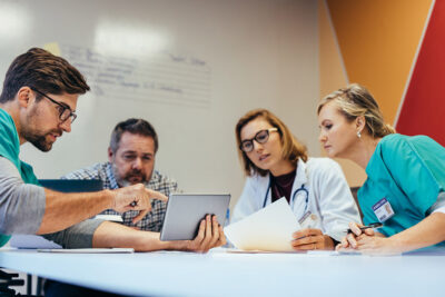 Hospital staff chaplain meeting Getty Images 844360434