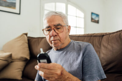 Older adult checking glucose Getty Images 1606162837