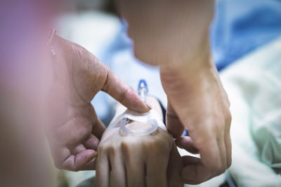 Patient hand with IV Getty Images 1159788515